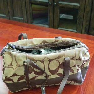 Brown and Tan cloth Coach bag